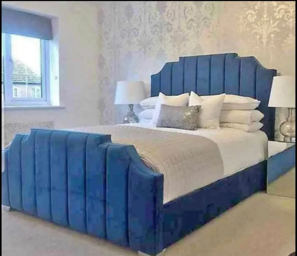 Elegant grey velvet Wingback Arizona bed frame with a high-panelled headboard and matching footboard.